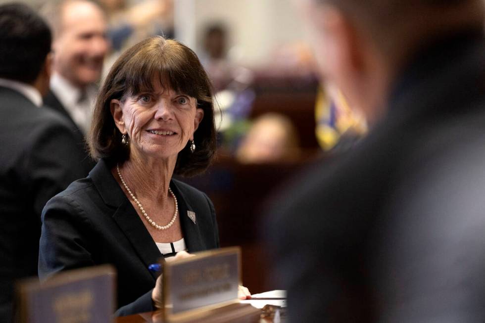 Sen. Robin L. Titus, R-Wellington, smiles while signing her oath of office during the first day ...