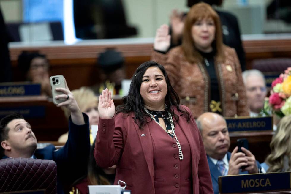 Assemblywoman Erica Mosca, D-Las Vegas, swears into the Assembly during the first day of the 82 ...