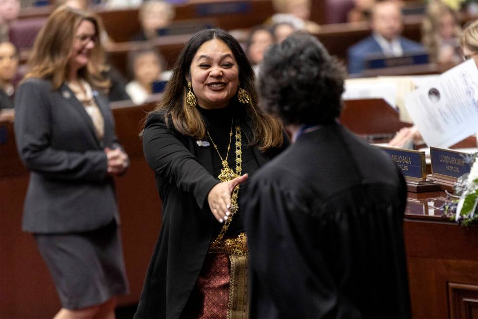 Assemblywoman Cecelia Gonzalez, D-Las Vegas, shakes the hand of Chief Justice Lidia S. Stiglich ...