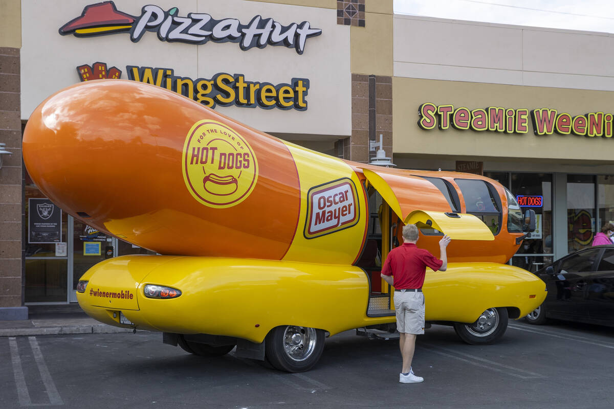 Tommy Salami exits the Oscar Mayer Wienermobile just parked outside the Steamie Weenie on Frida ...