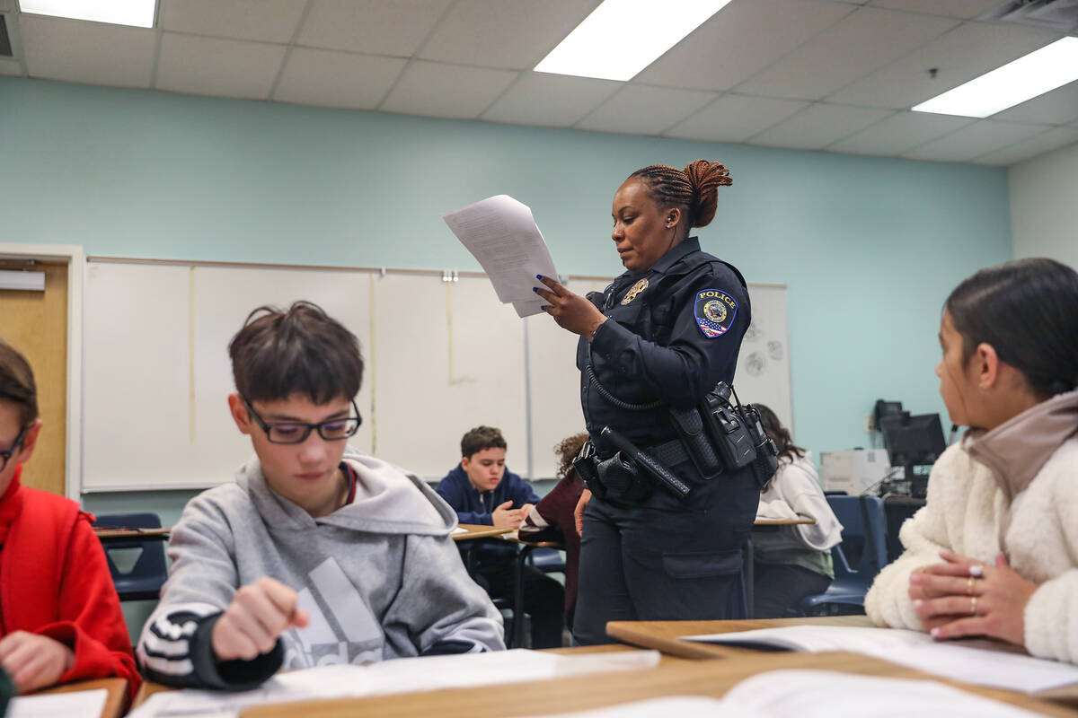 Clark County School District Police Officer Artesia Henry addresses students in a class for the ...