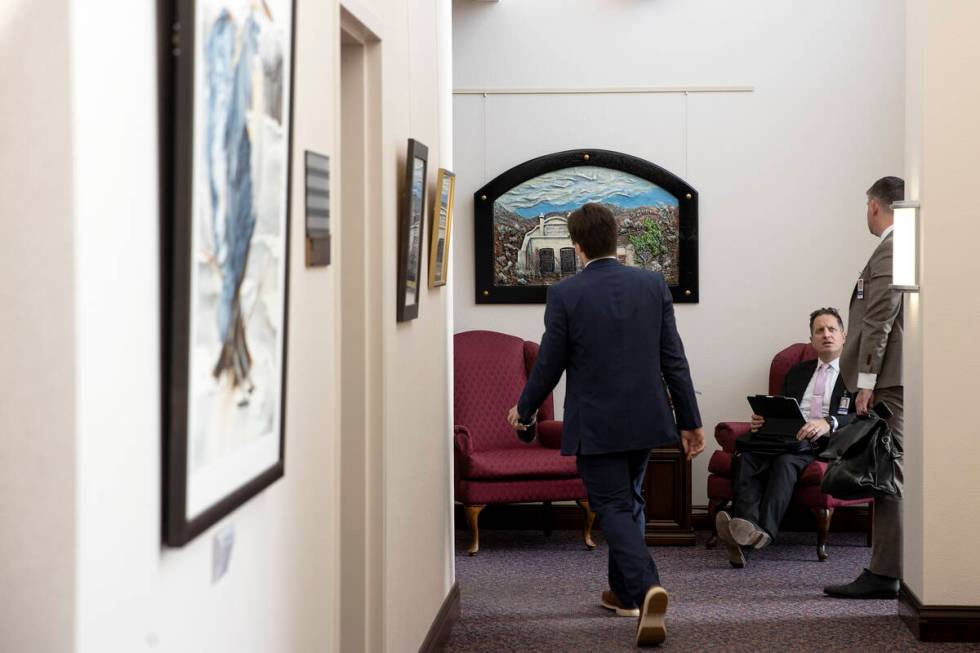 Lobbyists mill about the legislature building during the second day of the 82nd Session of the ...