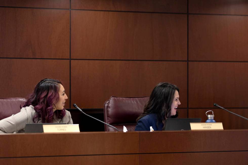 Assemblywomen Selena Torres, D-Las Vegas, and Alexis Hansen, R-Sparks, laugh with fellow lawmak ...