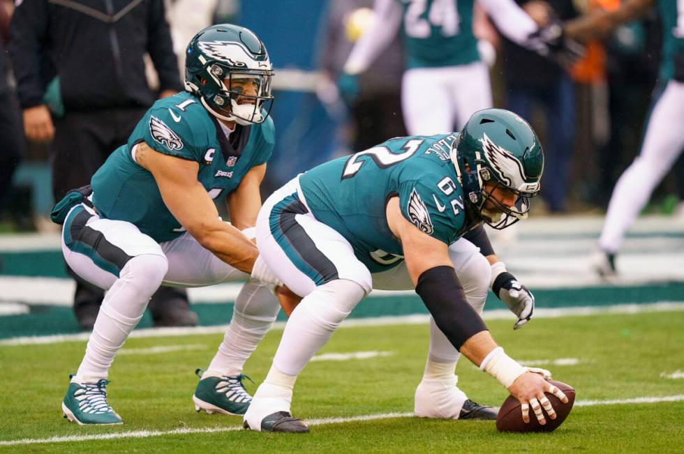 Philadelphia Eagles quarterback Jalen Hurts (1) warms up with center Jason Kelce (62) prior to ...