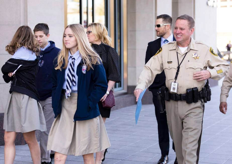 Sheriff Kevin McMahill, right, arrives to the Myron's at The Smith Center in Las Vegas, with hi ...