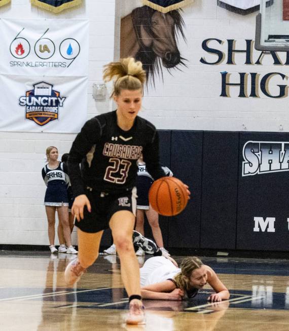 Faith Lutheran's Raina Forgue (23) drives past Shadow Ridge's Kelly Megown (4) during the secon ...