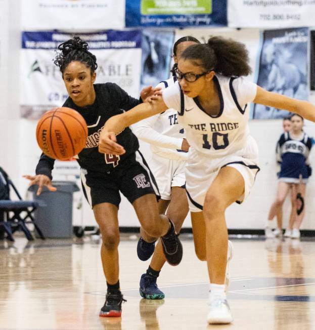 Faith Lutheran's Tamiah Harrison (4) and Shadow Ridge's Jaslyn Jefferson (10) fight for the loo ...