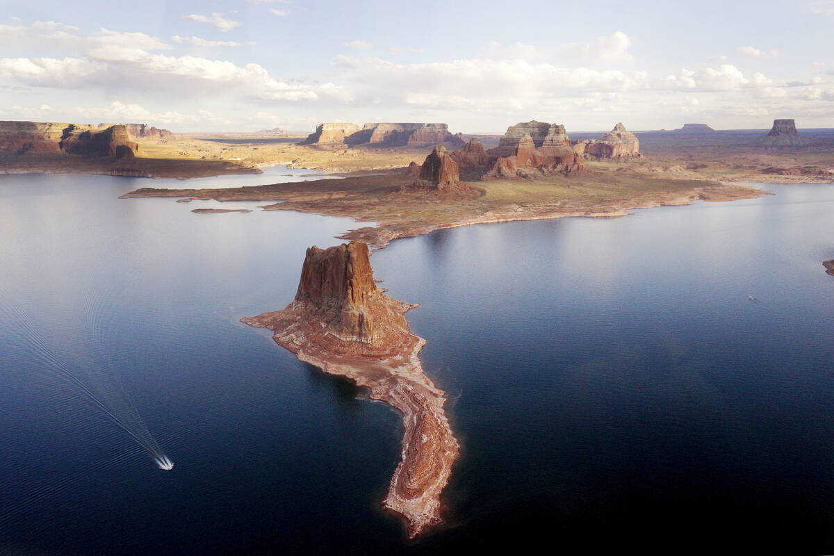 A boat makes its way around Padre Butte in Lake Powell near Page, Ariz., May 26, 2015. Lake Pow ...