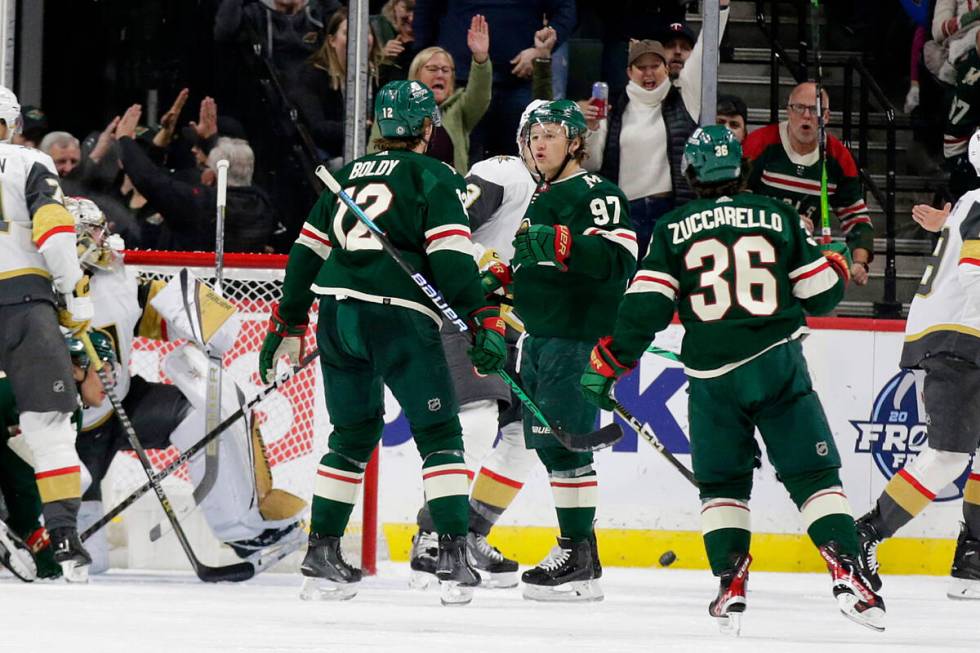 Minnesota Wild's Kirill Kaprizov (97) celebrates his goal with Wild teammates Matt Boldy (12) a ...