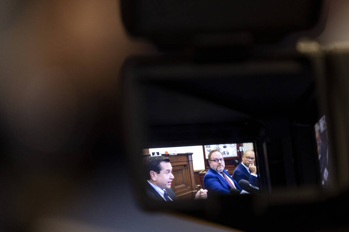 Nevada Secretary of State Cisco Aguilar speaks while Treasurer Zach Conine and Attorney General ...