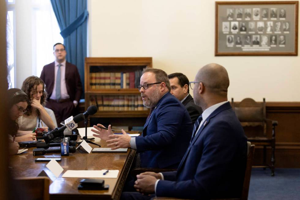 Nevada Treasurer Zach Conine, center, answers question flanked by Secretary of State Cisco Agui ...