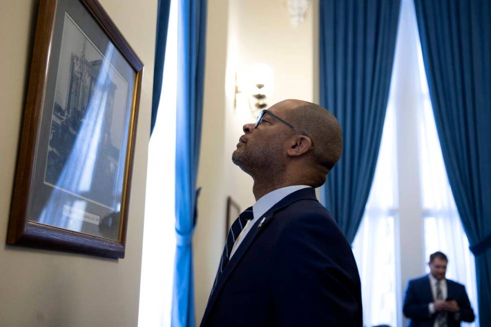 Nevada Attorney General Aaron Ford admires a portrait of the Supreme Court chambers circa 1908 ...