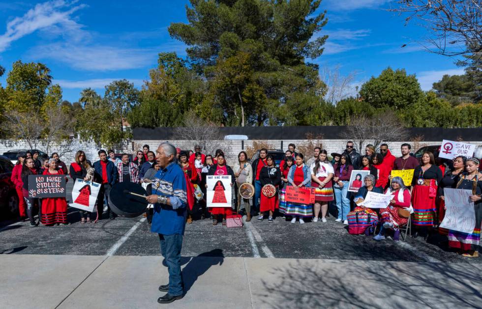 Johnnie Bobb, chief of the Western Shoshone National Council, performs a drum song as members o ...