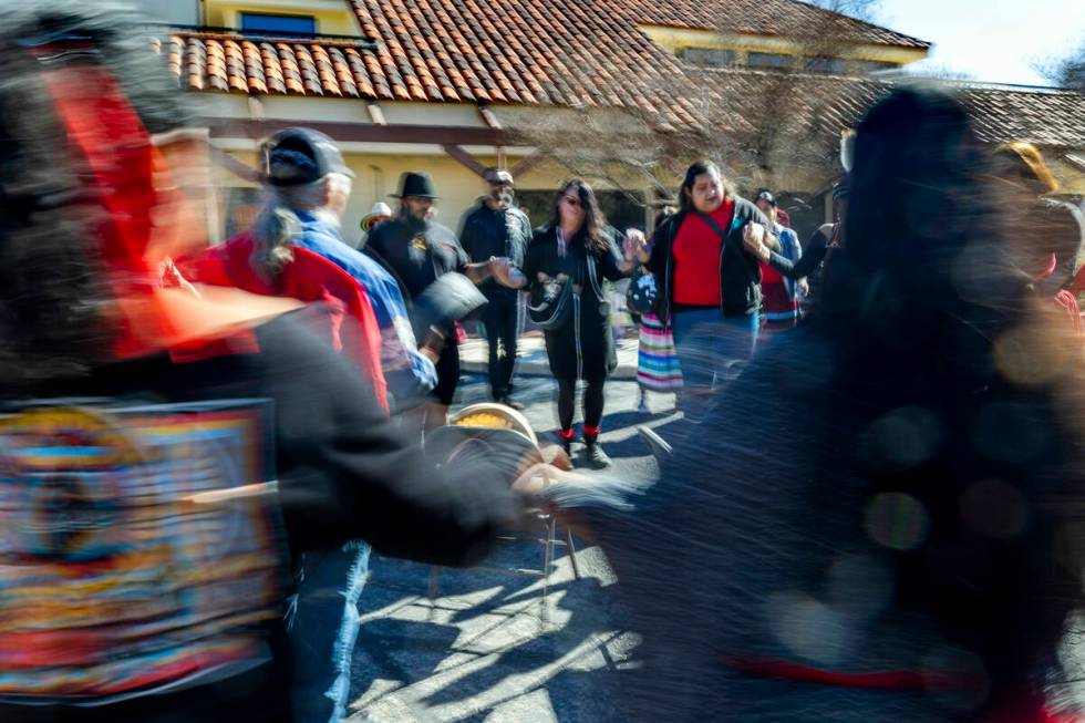 Members of the Native community and allies participate in a round dance as they gather in solid ...