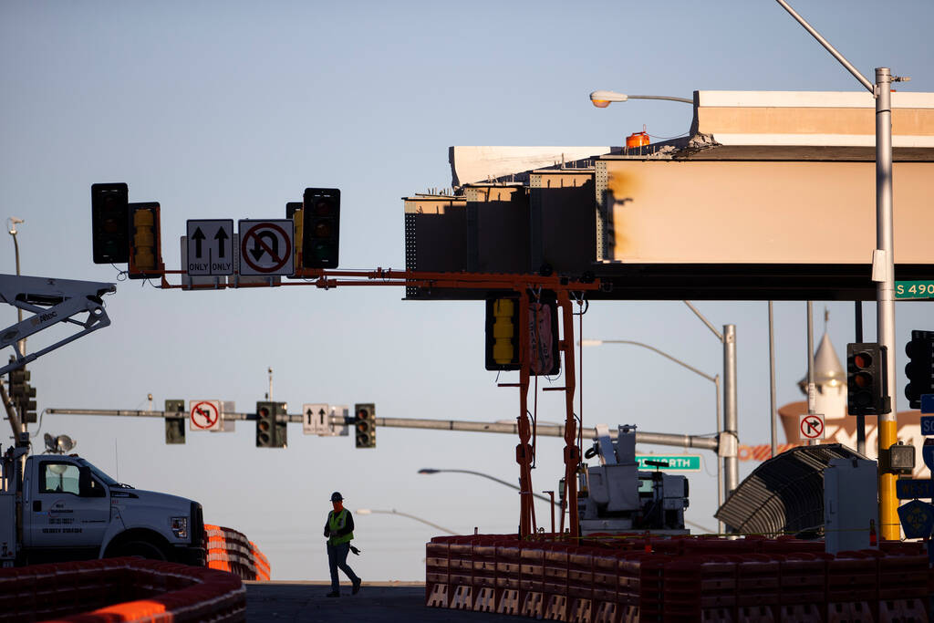 Construction crews work on Interstate 15 as the northern half of the Tropicana Avenue bridge ov ...