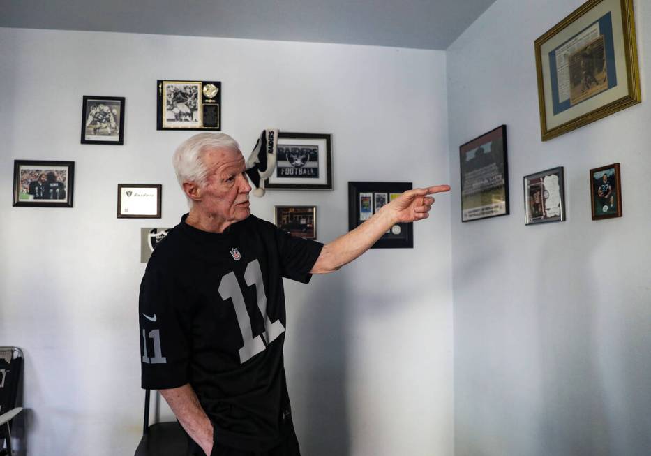 Tom Humm, brother to now-deceased David Humm, the former Raiders quarterback, points out memora ...