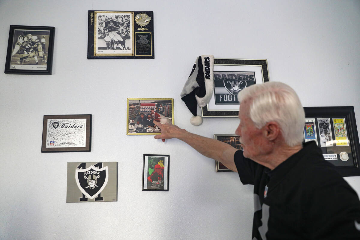 Tom Humm, brother to now deceased David Humm, the former Raiders quarterback, points out memora ...