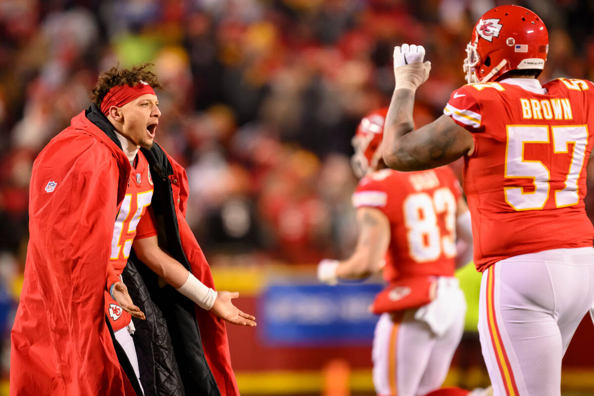 Kansas City Chiefs quarterback Patrick Mahomes comes onto the field to congratulate the PAT tea ...