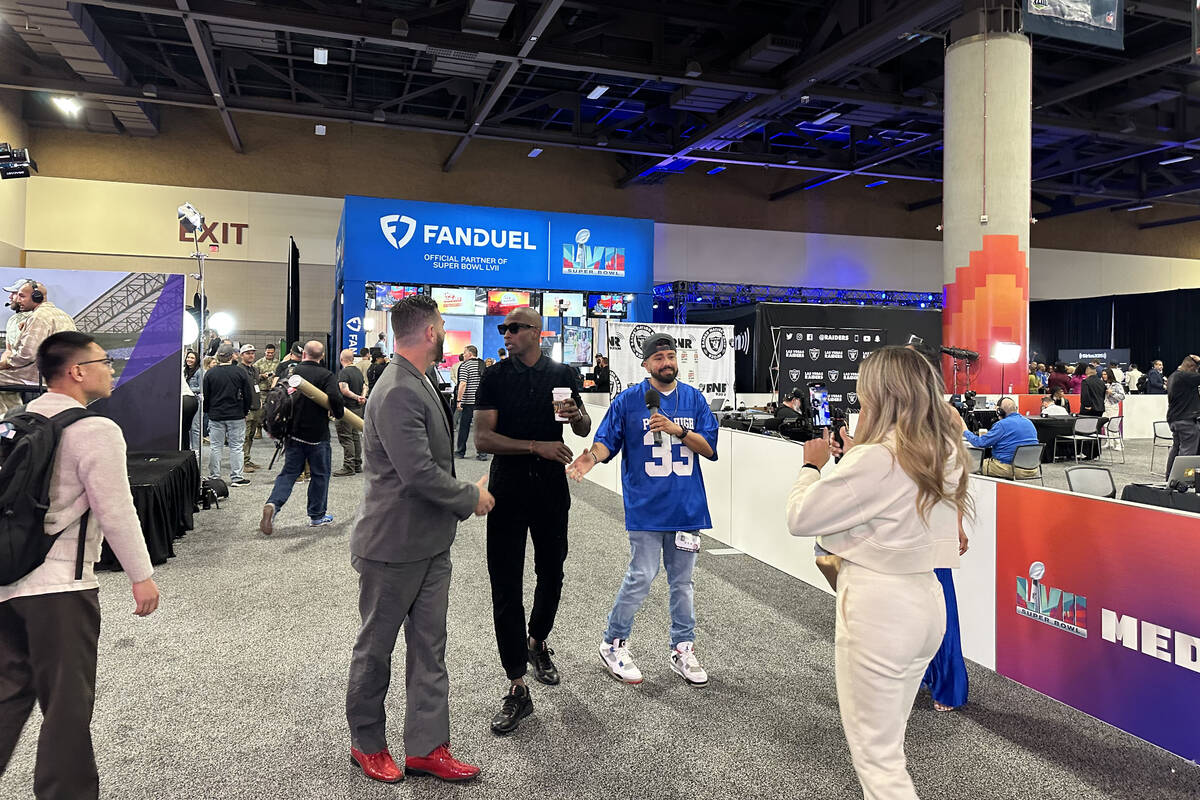 Chad "Ochocinco" Johnson is interviewed in radio row during Super Bowl LVII week at the Phoenix ...