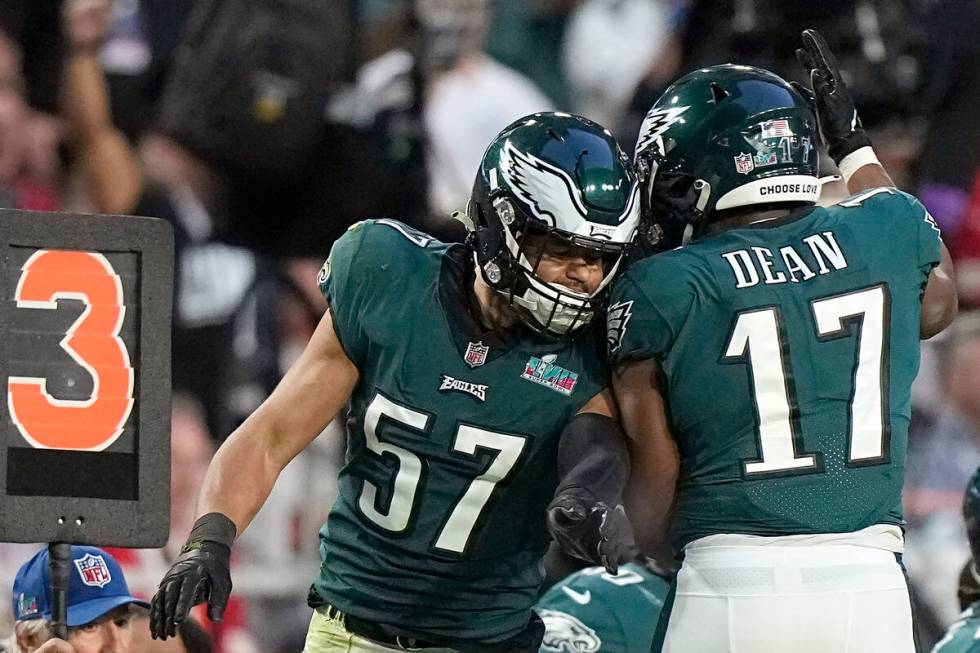 Philadelphia Eagles linebacker T.J. Edwards (57) celebrates with linebacker Nakobe Dean (17) af ...