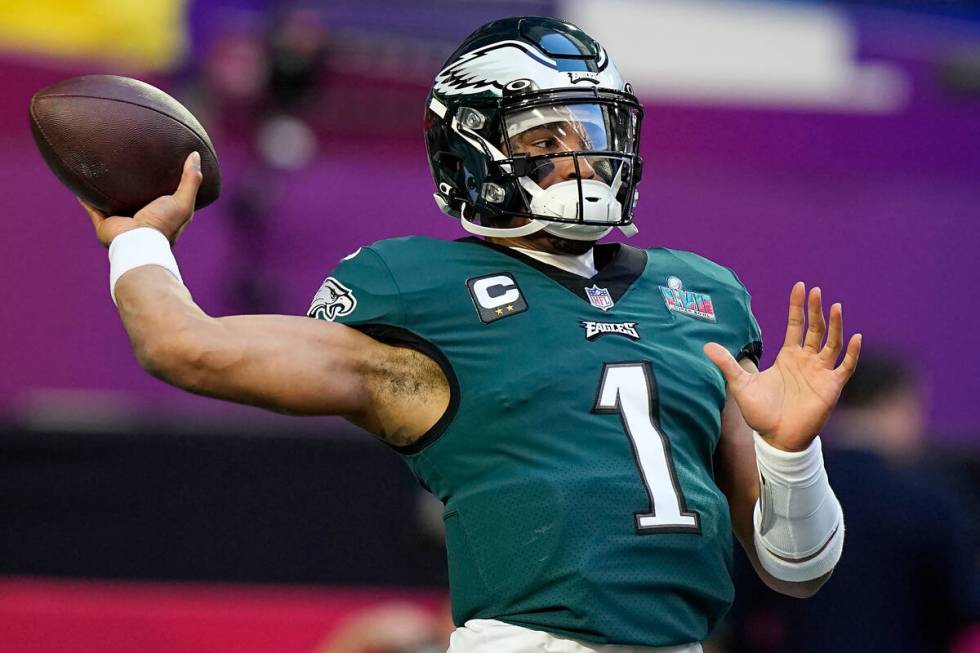 Philadelphia Eagles quarterback Jalen Hurts (1) warms up before the NFL Super Bowl 57 football ...