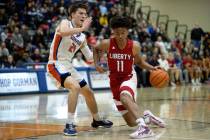 Liberty’s Dedan Thomas Jr. (11) dribbles around Bishop Gorman’s Ryder Elisaldez ( ...