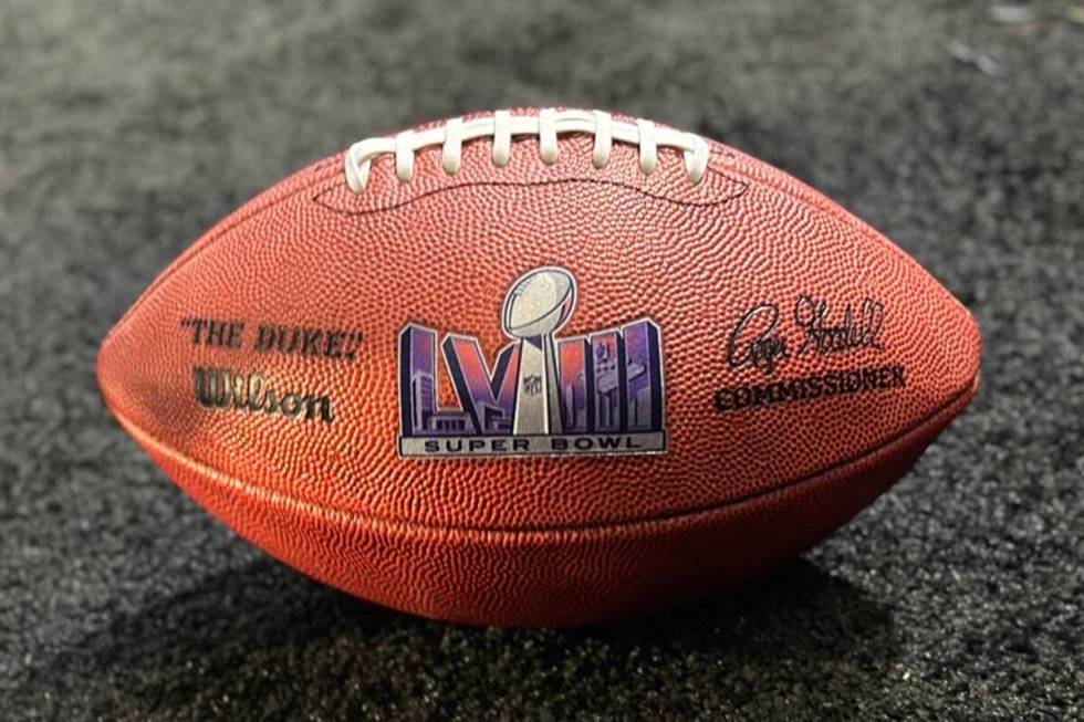 The first Super Bowl LVIII football displayed at the Phoenix Convention Center Feb. 13, 2023. ( ...
