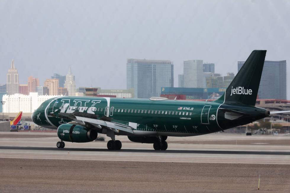 A JetBlue plane arrives to Harry Reid International Airport in Las Vegas, Tuesday, Feb. 14, 202 ...