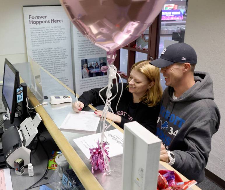 Josh and Carrie Johnson of Gobles, Mich. get their marriage license at Harry Reid International ...