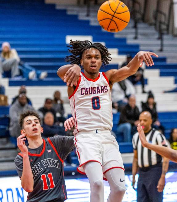 Coronado's Johnny Collins (0) elevates to pass over Arbor View's Ridge Adams (11) during the fi ...