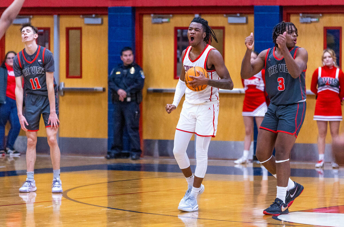 Coronado's Sebastian Mack (12) lis pumped after securing a late rebound from Arbor View's Brian ...