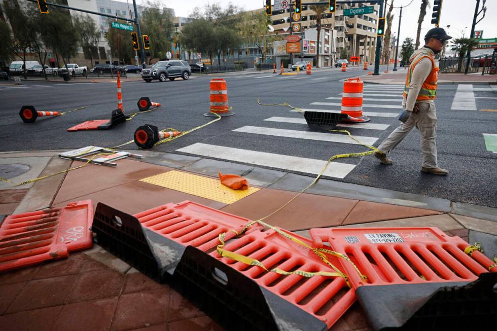 Traffic cones are knocked down by windy weather, Tuesday, Feb. 14, 2023, in downtown Las Vegas. ...