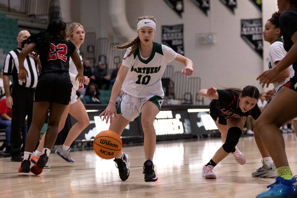 FILE - Palo Verde’s Reagan Nehls (10) drives toward the hoop while Las Vegas’ Layla Faught, ...