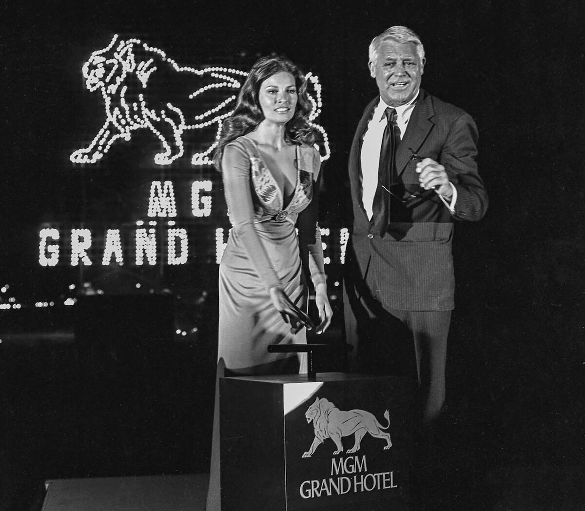 Raquel Welch and Cary Grant press a ceremonial plunger during the opening of the original MGM G ...