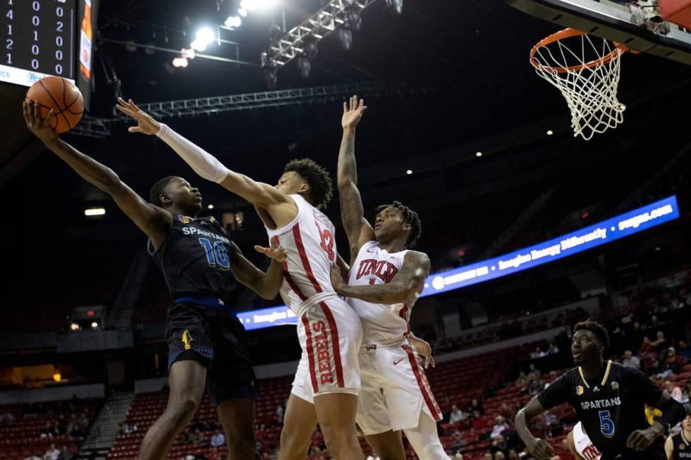 San Jose State Spartans guard Omari Moore (10) shoots against UNLV Rebels center David Muoka (1 ...