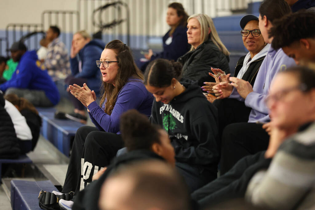 People cheer during a girls class 5A southern region semifinal game between Centennial and Fait ...