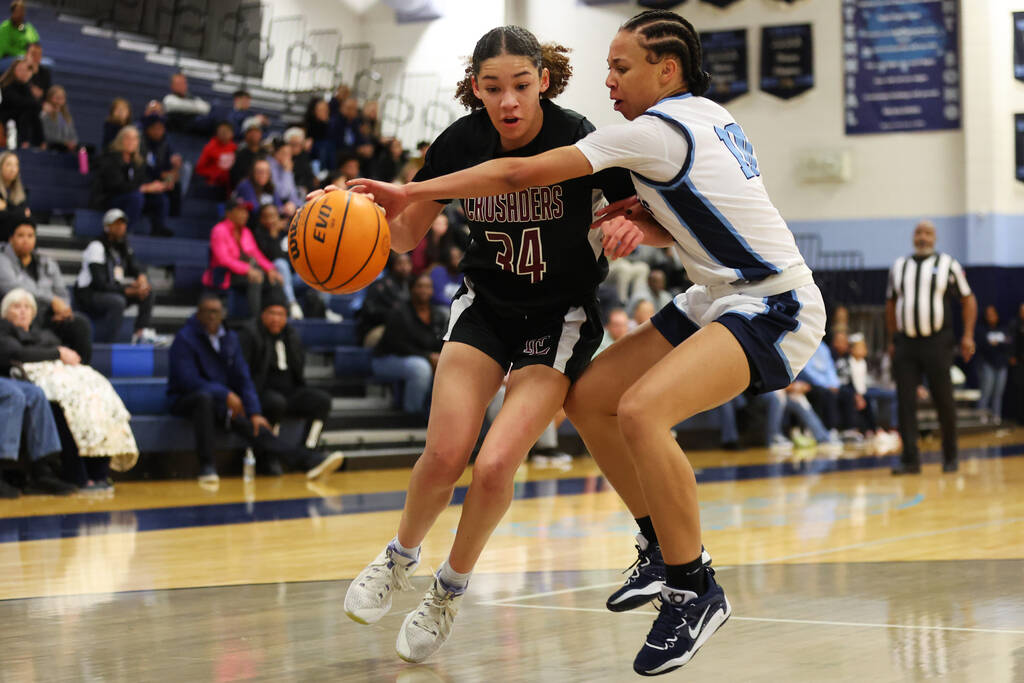 Centennial's Tayla Perkins (10) defends against Faith Lutheran's Tayla Perkins (34) during a gi ...
