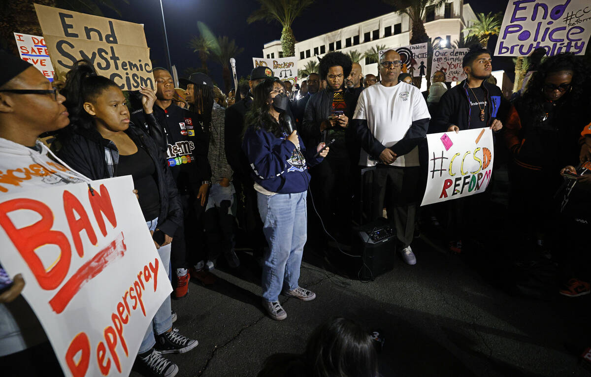 Las Vegas Academy of the Arts senior Crystal Villarin, 18, center, speaks during a rally outsid ...