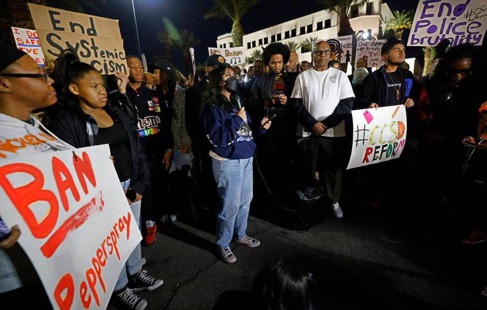 Las Vegas Academy of the Arts senior Crystal Villarin, 18, center, speaks during a rally outsid ...