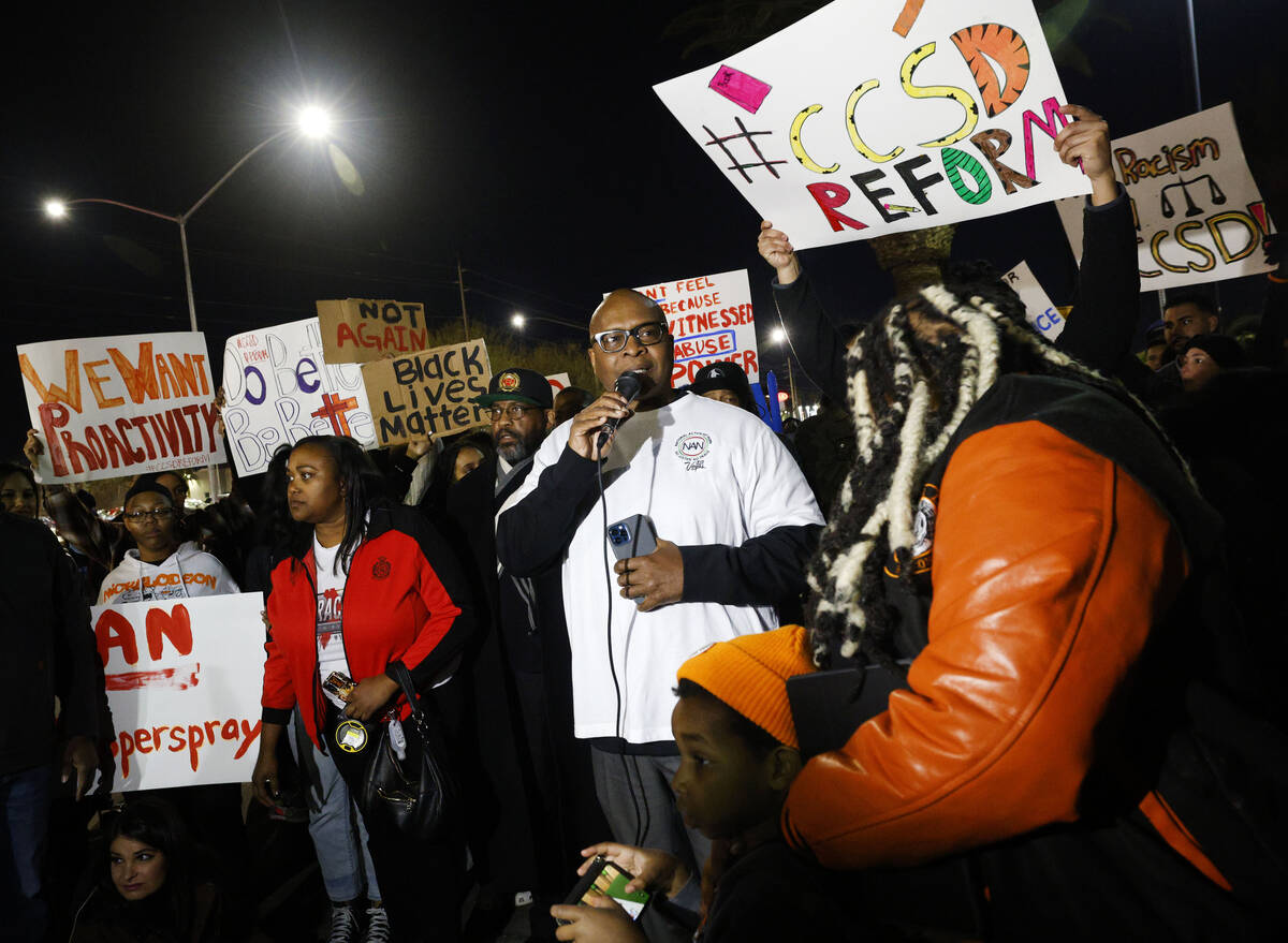 Robert Bush, president of National Action Network, center, speaks during a rally outside the Cl ...