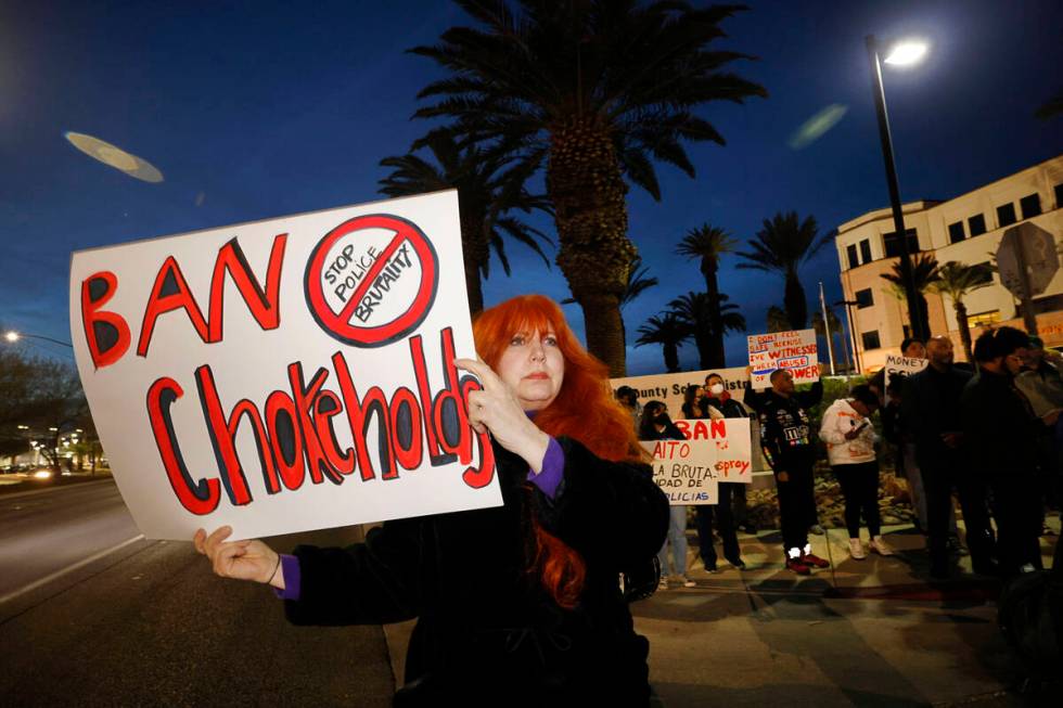 Protesters including Pam Jahan-Shahi of Henderson hold signs outside the Clark County School Di ...