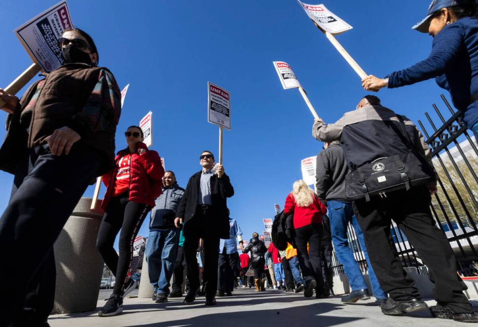 Culinary union workers picket in front of the Las Vegas Convention Center on Thursday, Feb. 16, ...