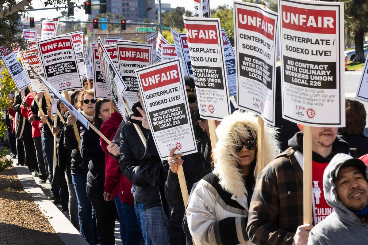 Culinary union workers picket in front of the Las Vegas Convention Center on Thursday, Feb. 16, ...