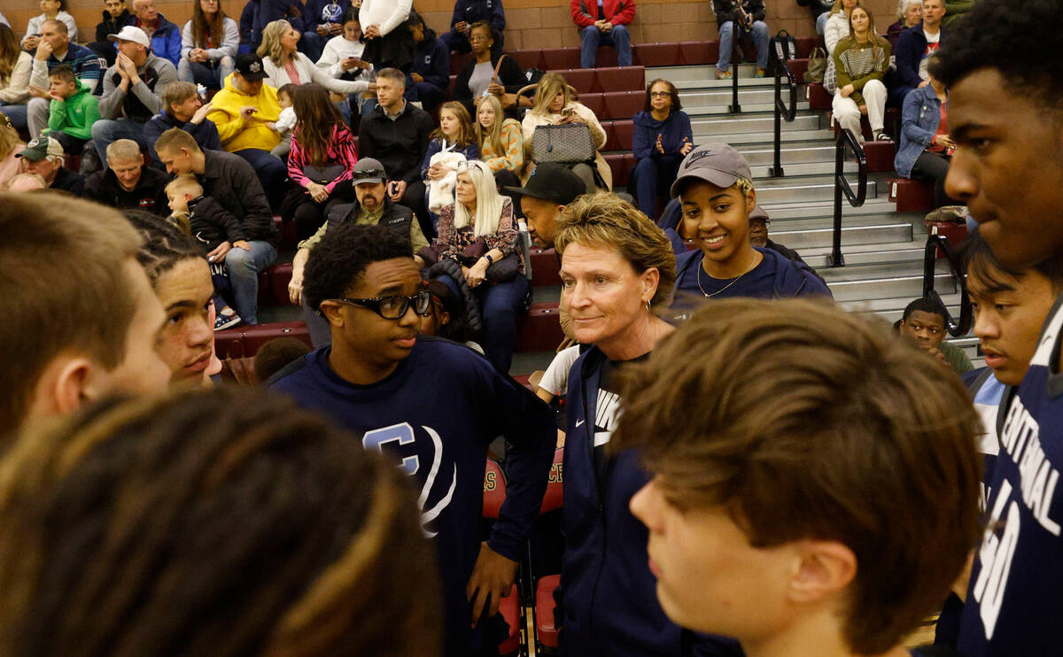 Centennial's head coach Karen Weitz, center, talks with her players before a basketball game ag ...
