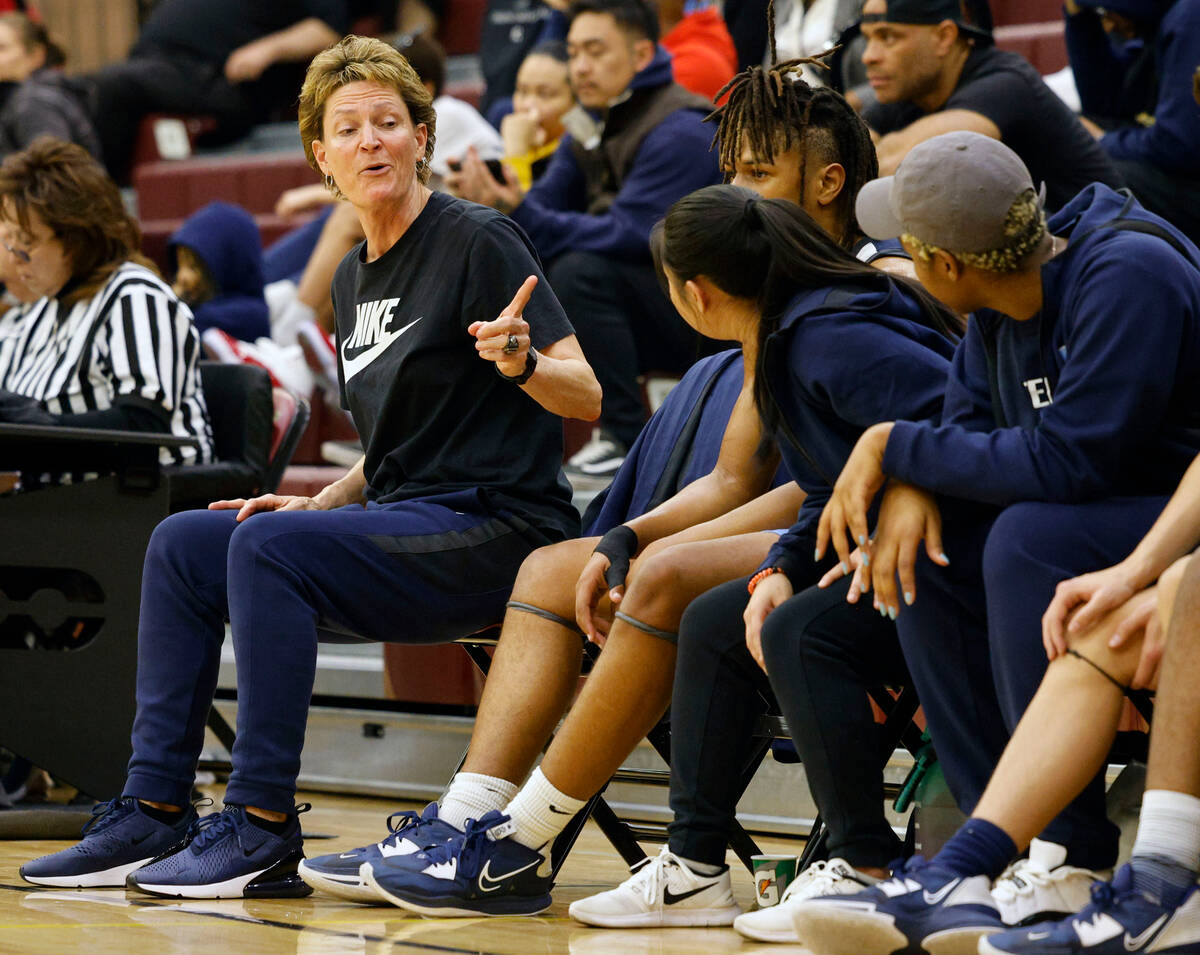 Centennial's head coach Karen Weitz, second from left, talks to her players during the second h ...