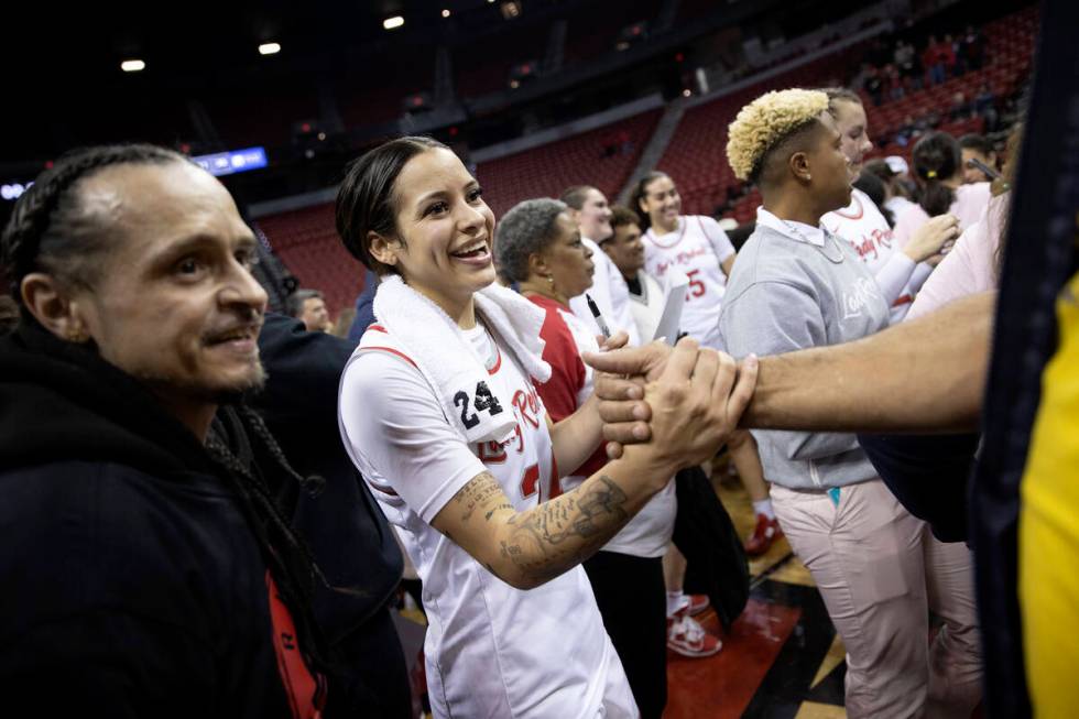 UNLV Lady Rebels guard Essence Booker (24) greets fans after winning an NCAA college basketball ...
