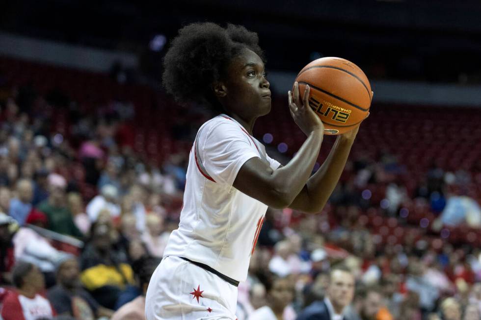 UNLV Lady Rebels guard Jasmyn Lott attempts a three-pointer during the first half of an NCAA co ...