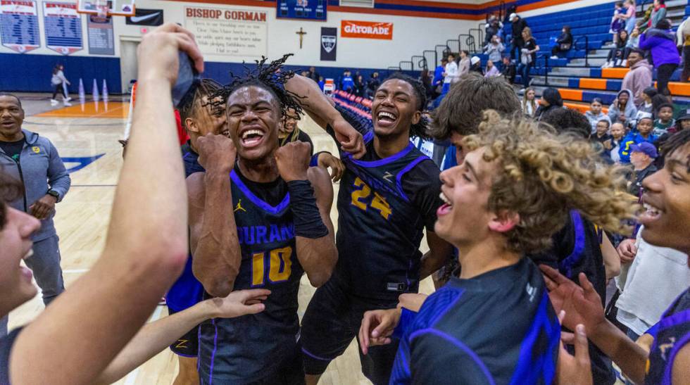 Durango's Tylen Riley (10) and teammates celebrate after defeating Bishop Gorman following the ...