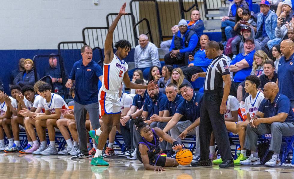 Durango's Tylen Riley (10) is driven out of bounds by Bishop Gorman's Keenan Bey (2) looking do ...