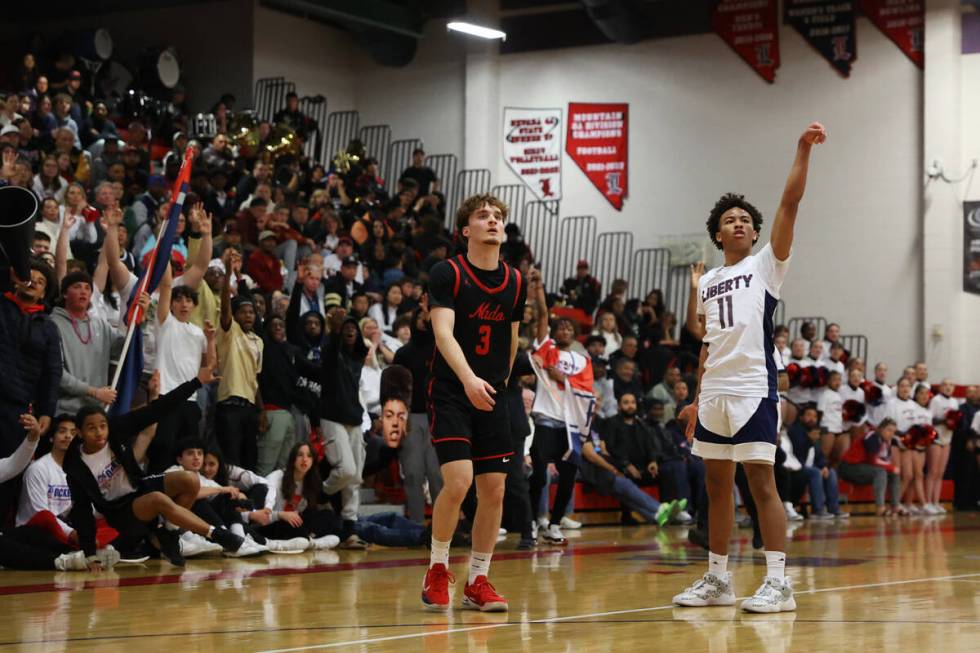 Coronado's Blake Sullivan (3) looks on after a shot by Liberty's Dedan Thomas (11) during a boy ...